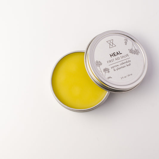 first aid salve with calendula yarrow and plantain leaf open