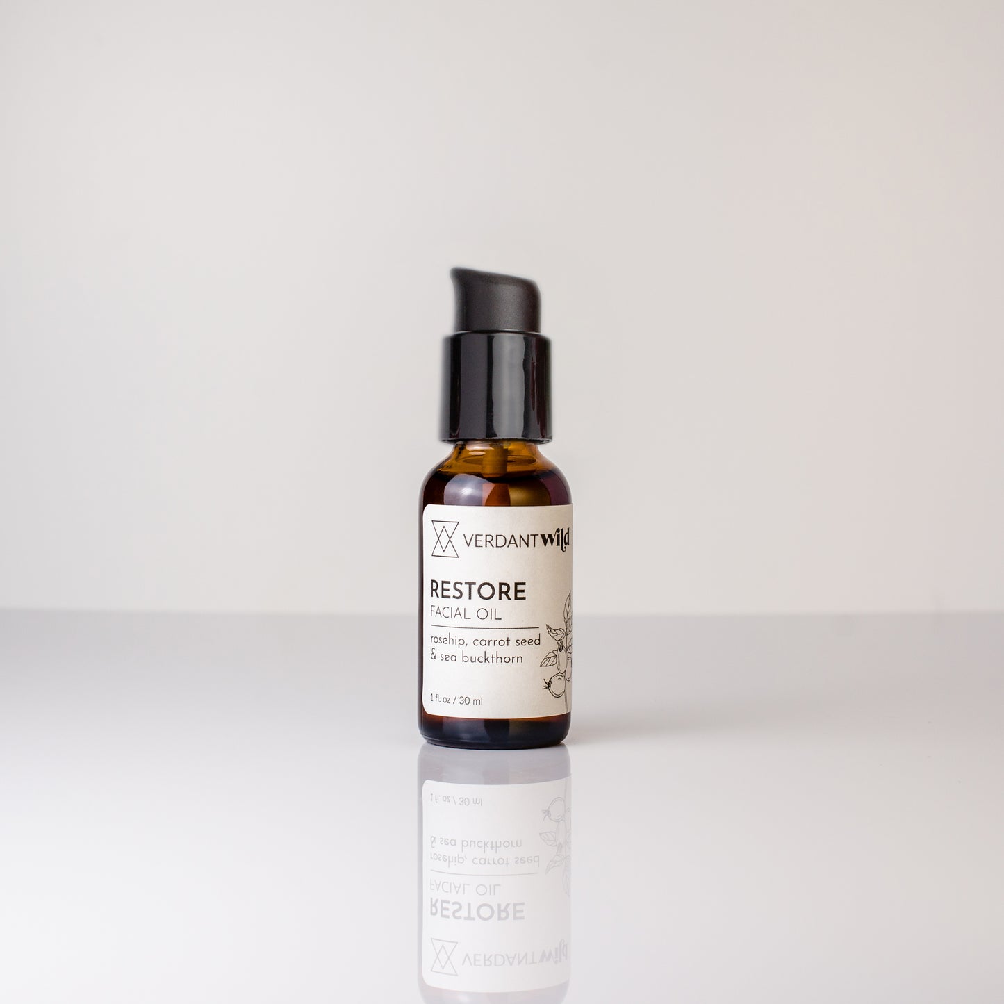 Bottle of Verdant Well Restore Oil on a white background