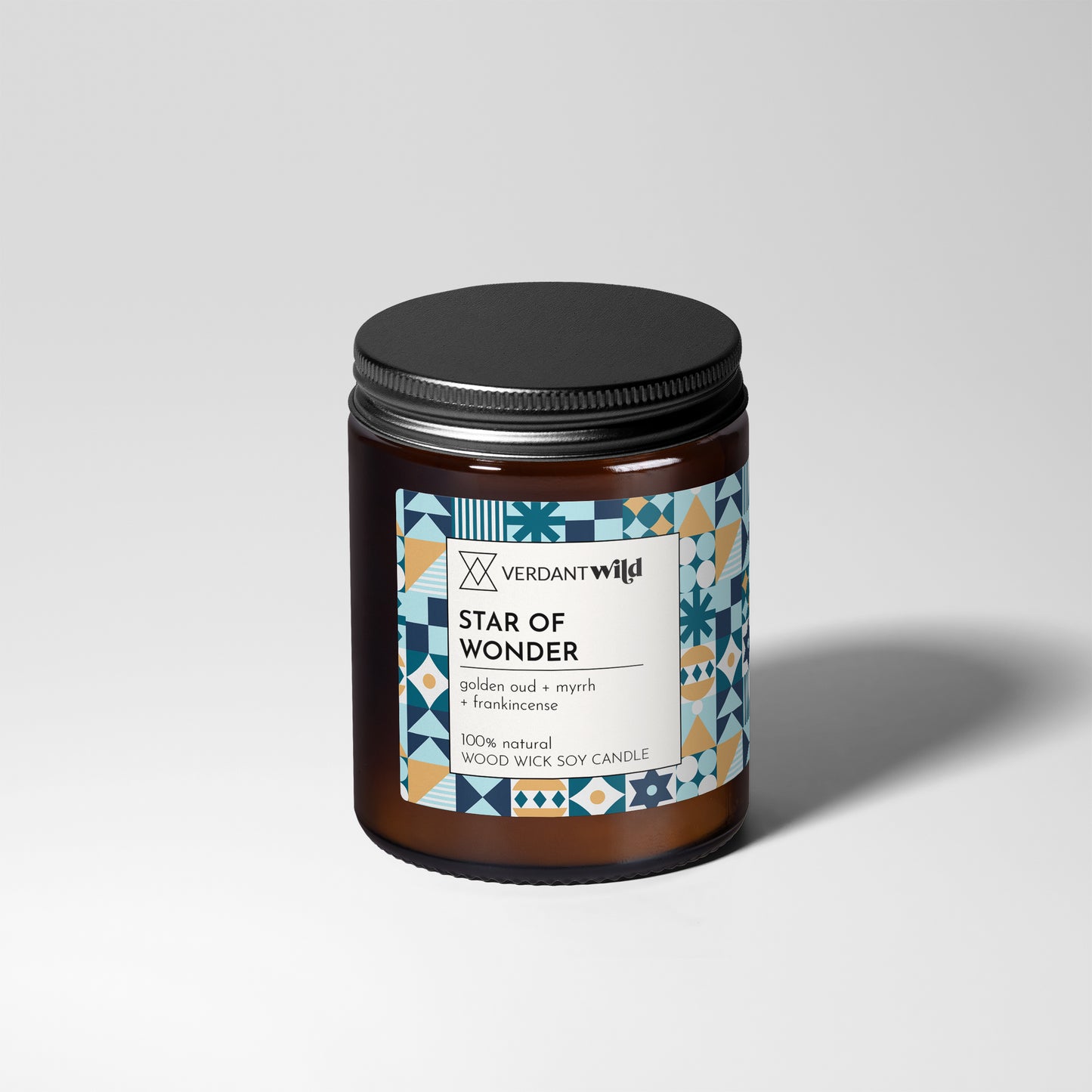 Candle jar labeled 'Star of Wonder' by Verdant Wild on a light gray background