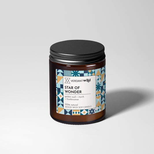Candle jar labeled 'Star of Wonder' by Verdant Wild on a light gray background