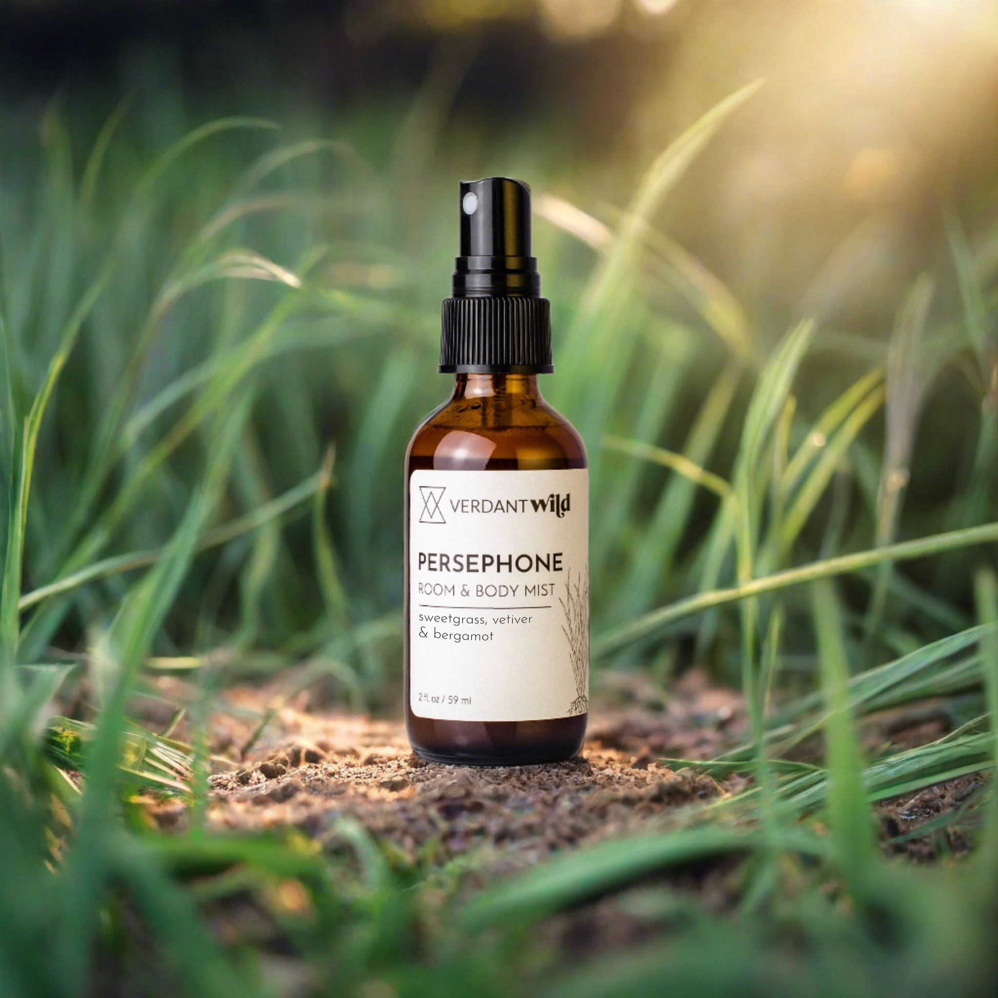 bergamot, vetiver and lavender room and body mist open sitting on soil in grass