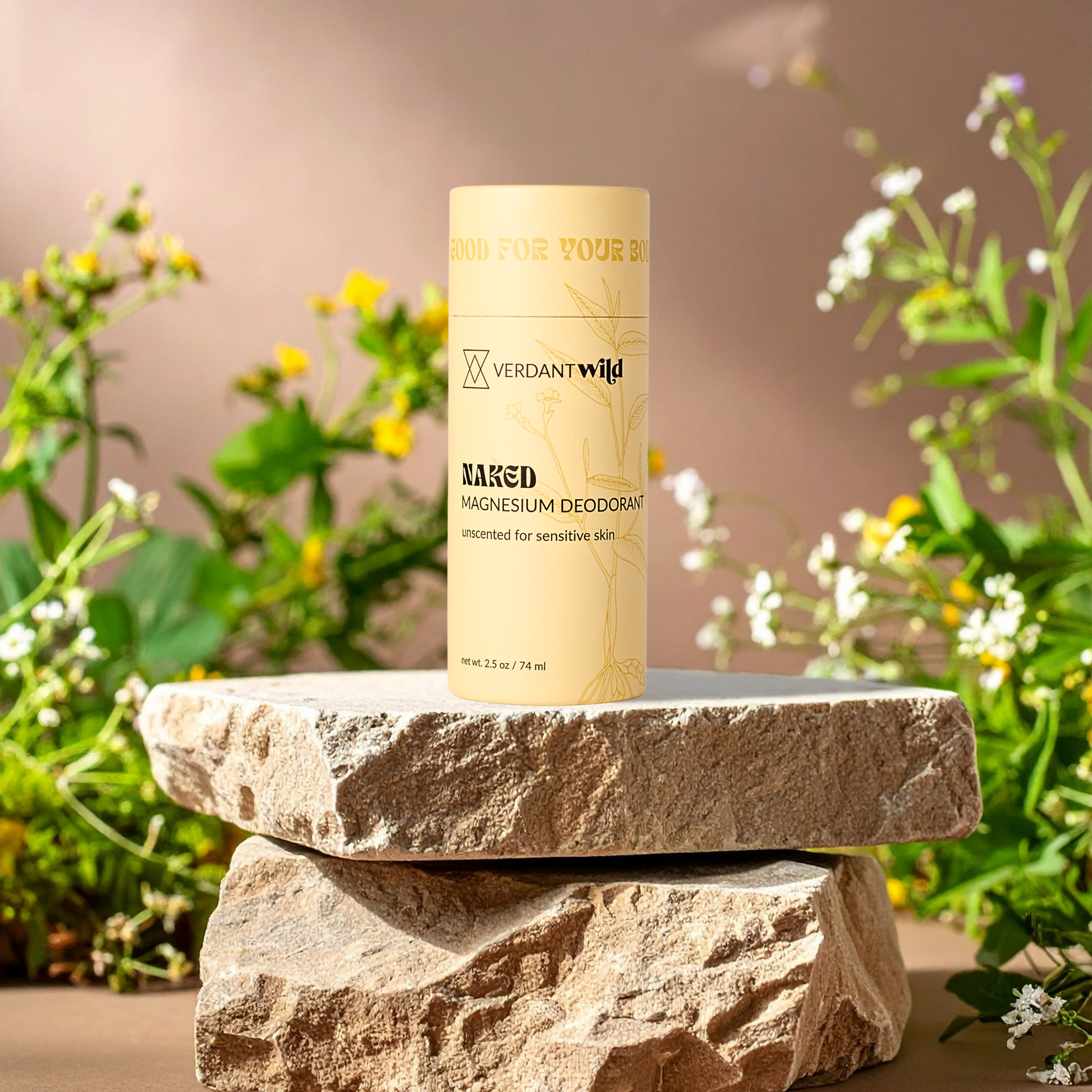 Verdant Wild Naked Magnesium Deodorant on a stone surface with plants in the background