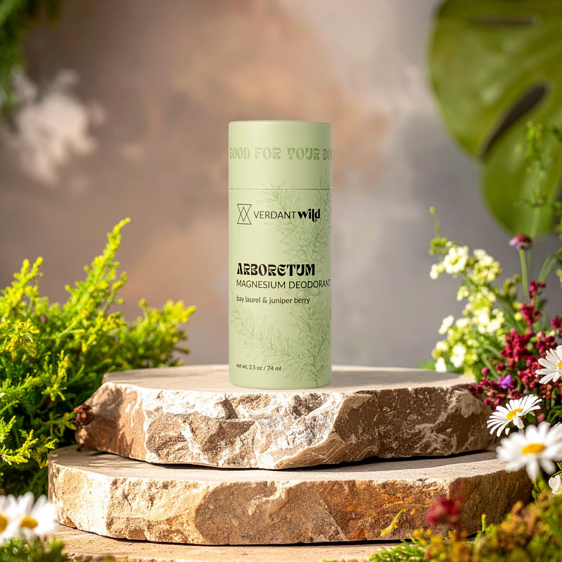 Green deodorant container on a stone surface with natural background