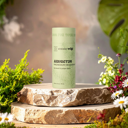 Green deodorant container on a stone surface with natural background