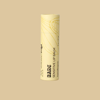 A single tube of Bare Sensitive Lip Balm in a pale yellow packaging with black text and line art, standing upright