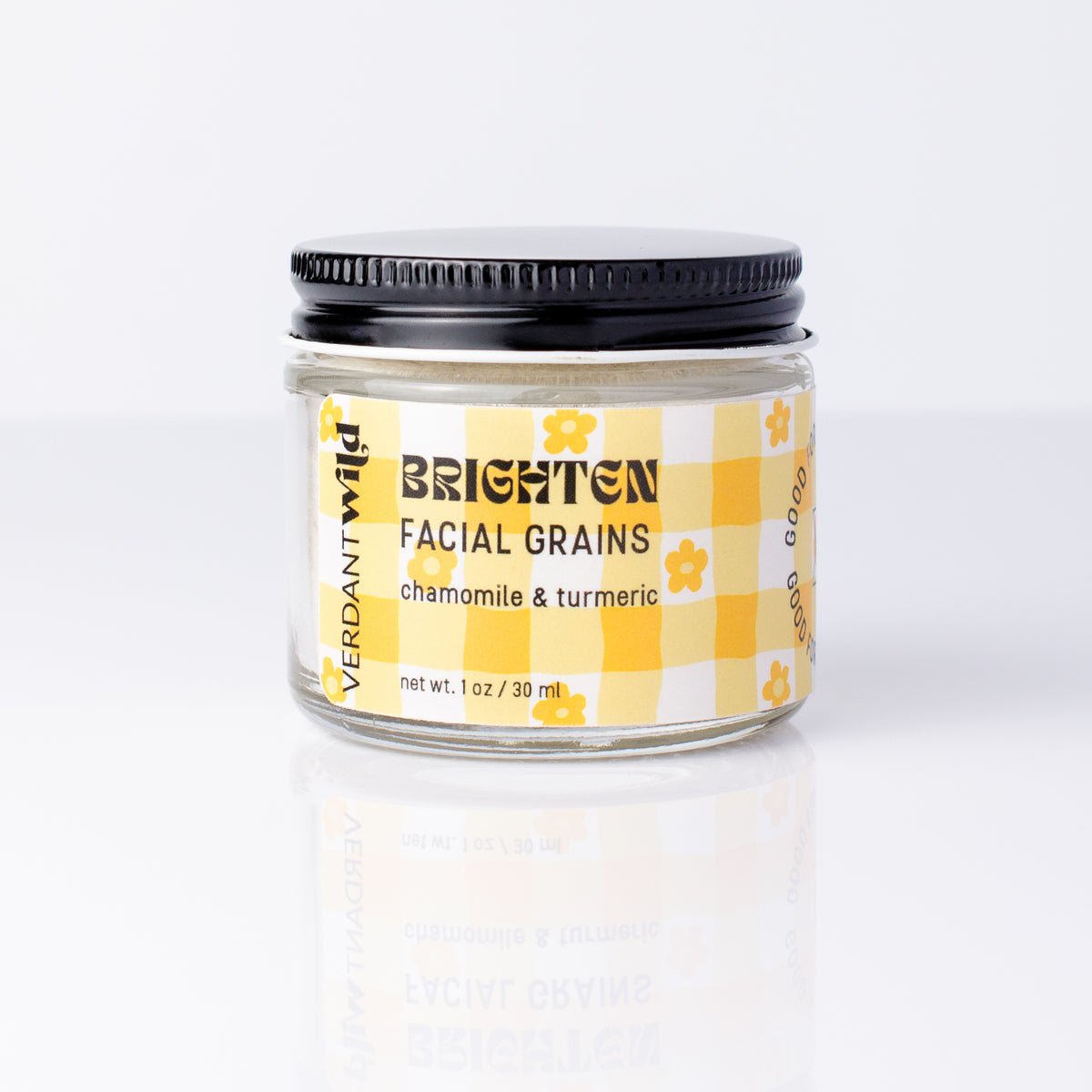 jar of turmeric and chamomile "Brighten" face mask on white background
