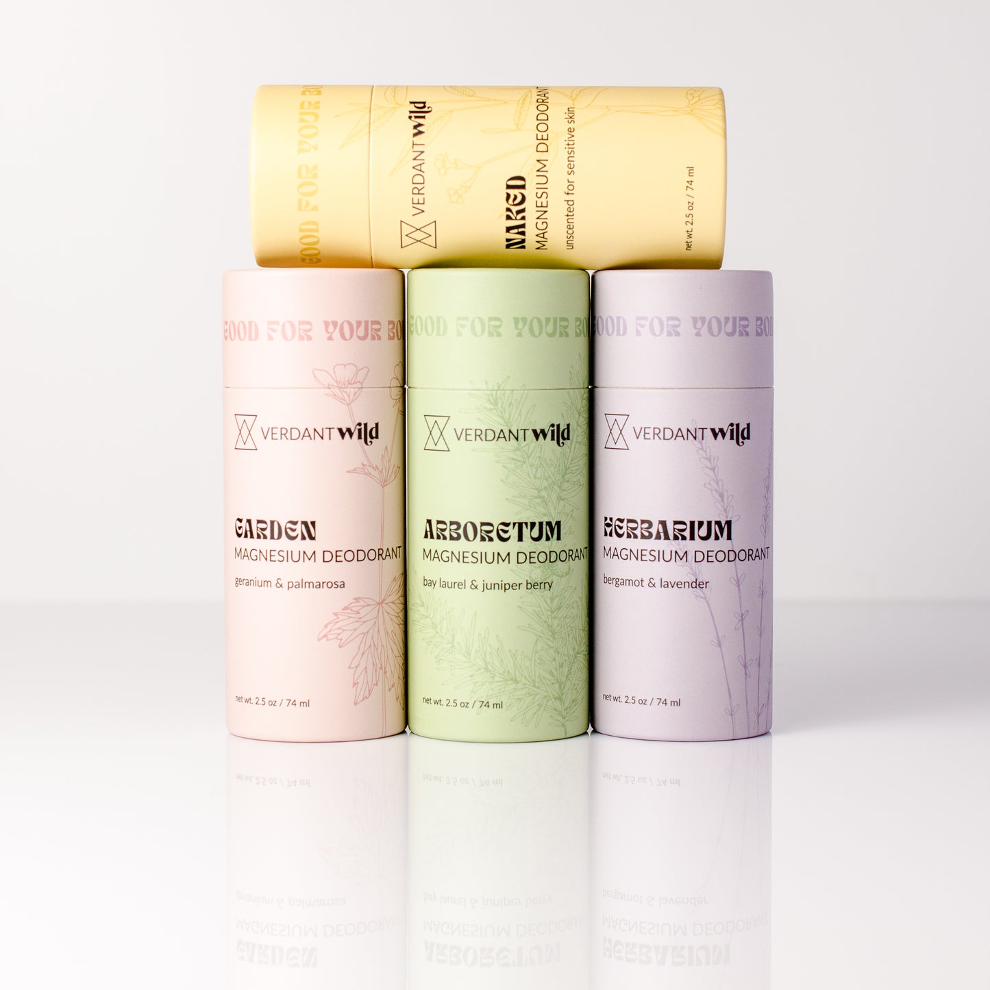 Magnesium deodorant containers in different scents on a white background