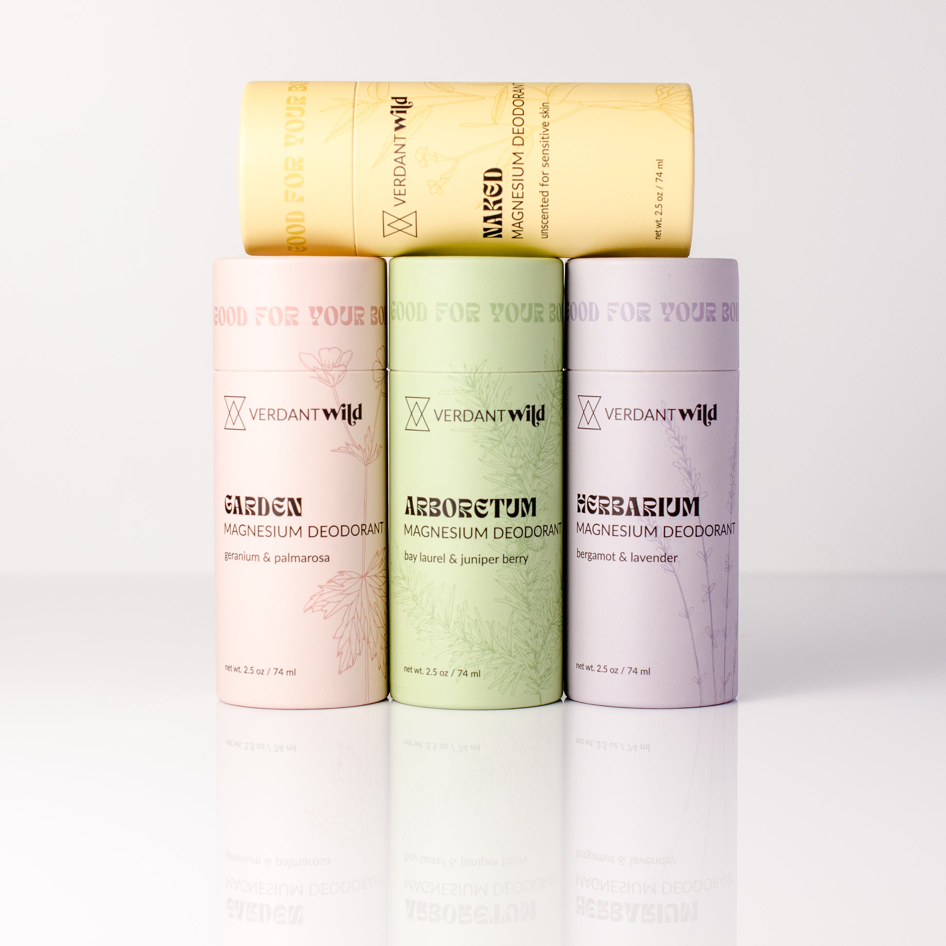 Magnesium deodorant containers in different scents on a white background