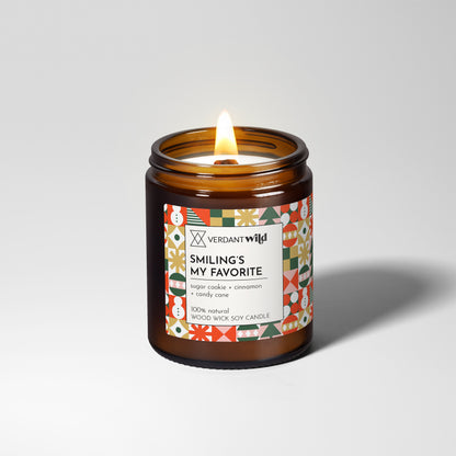 Candle in a glass jar with a colorful label on a white background