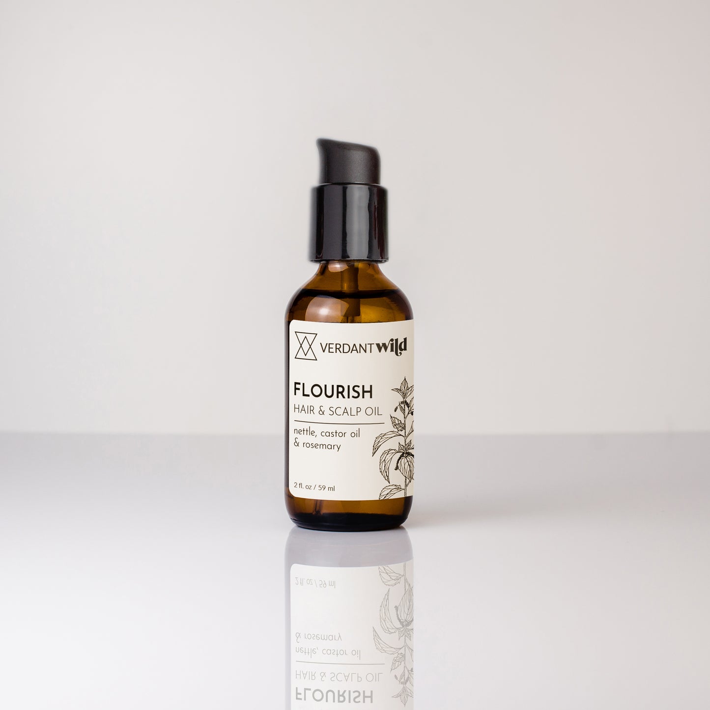 Bottle of Verdant Wild Flourish Hair & Scalp Oil on a white background