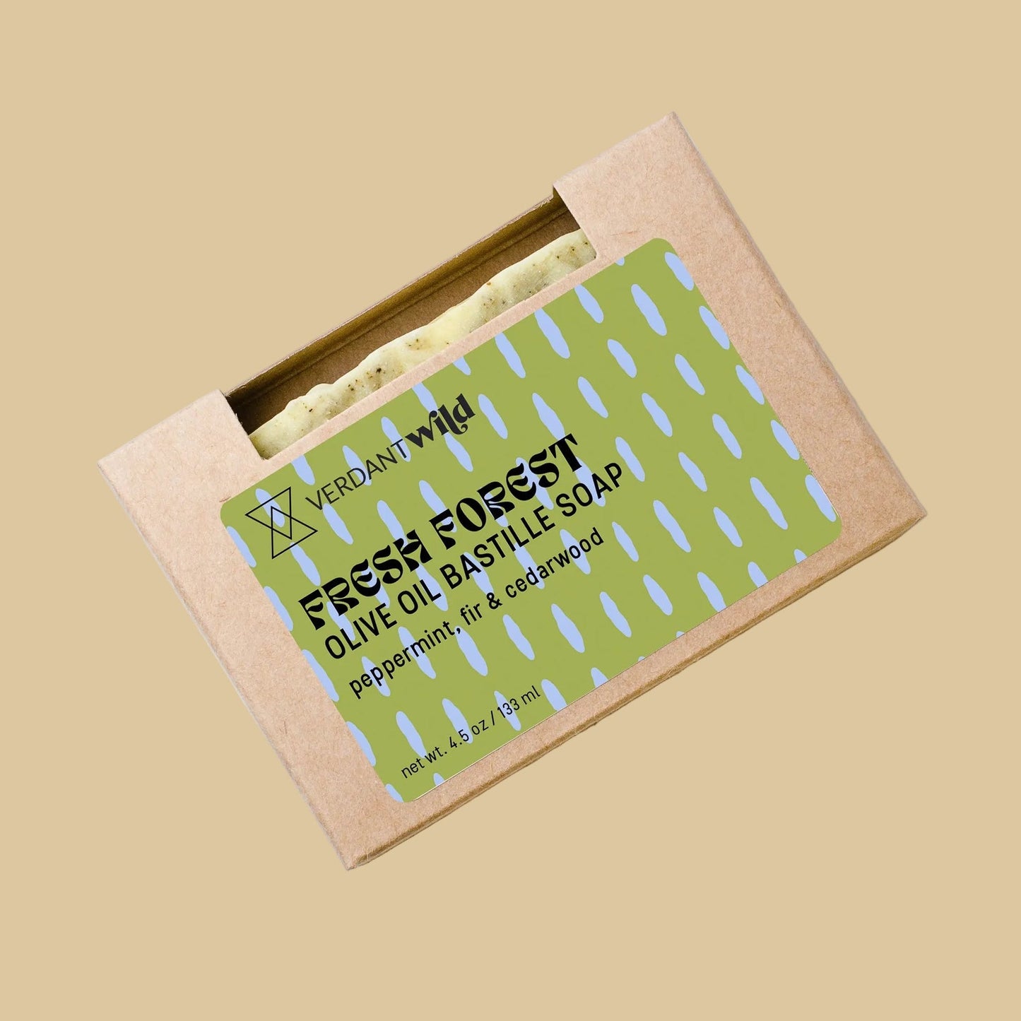 A kraft paper box of Verdant Wild Fresh bar of soap through a cutout window and a green patterned label, set against a plain background.