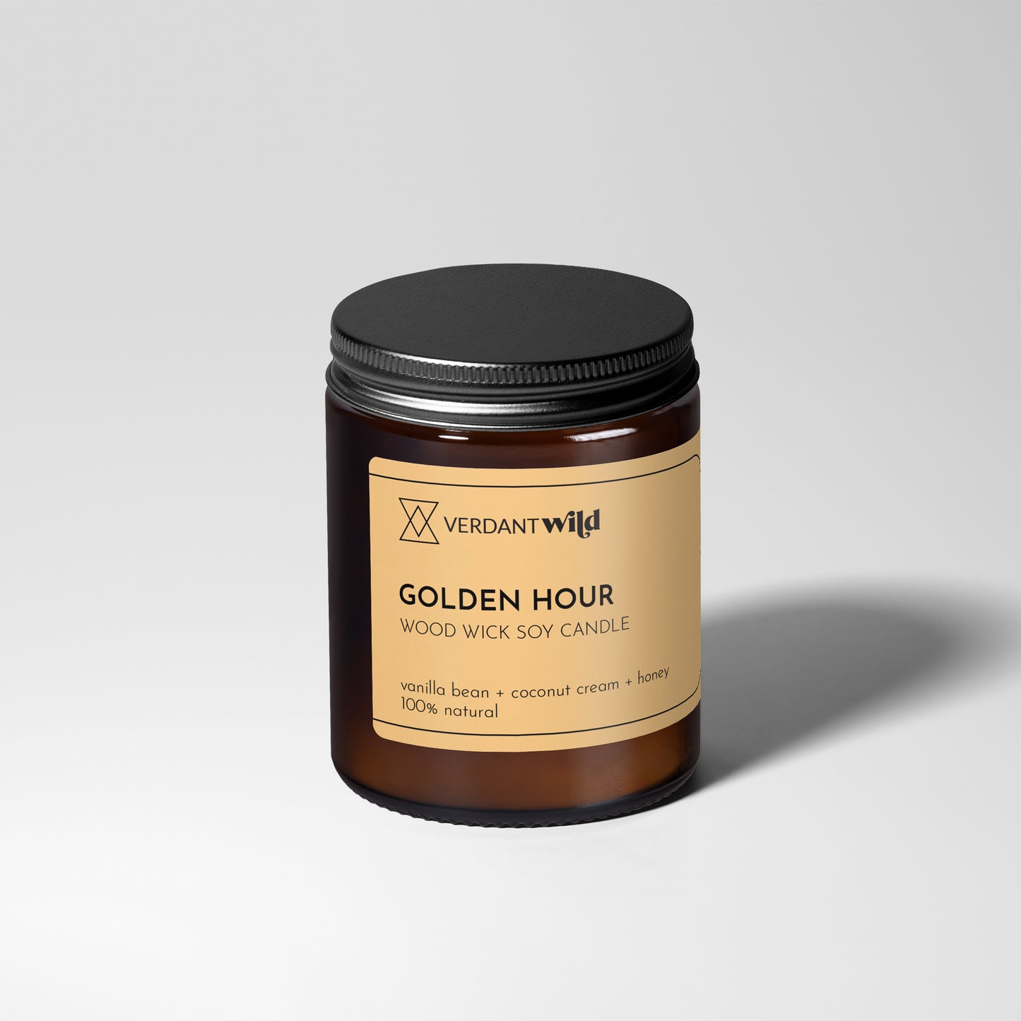 Verdant Wild candle with a black lid on a light gray background