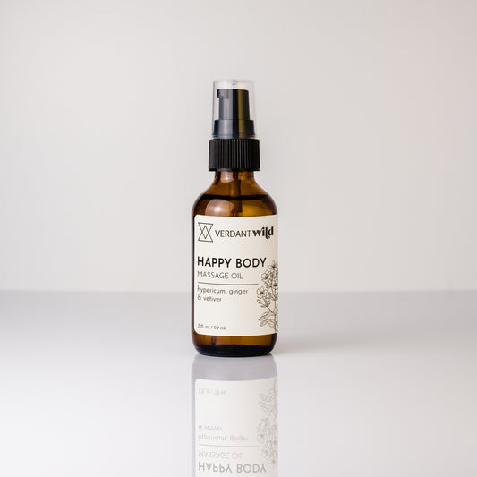 Bottle of Verdant Wild Happy Body Massage Oil on a white background