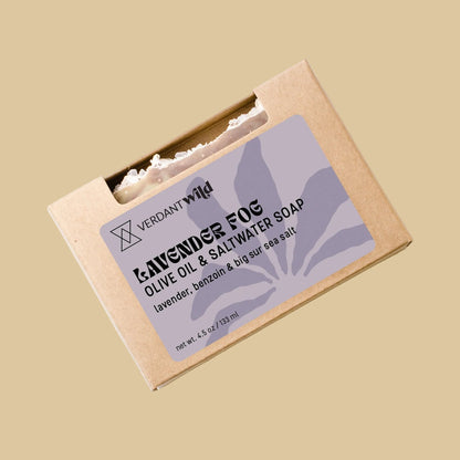A kraft paper soap box labeled 'Lavender Fog' by Verdant Wild, containing olive oil and saltwater soap, photographed on a neutral background.