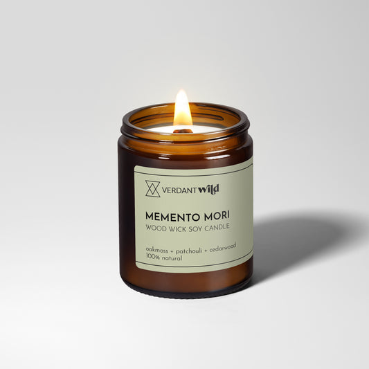 Candle in a glass jar with a label on a white background
