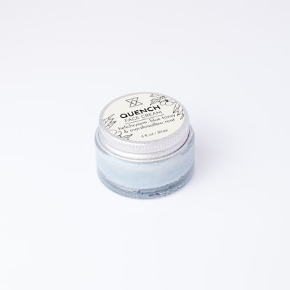 Jar of face cream labeled 'Quench' on a white background