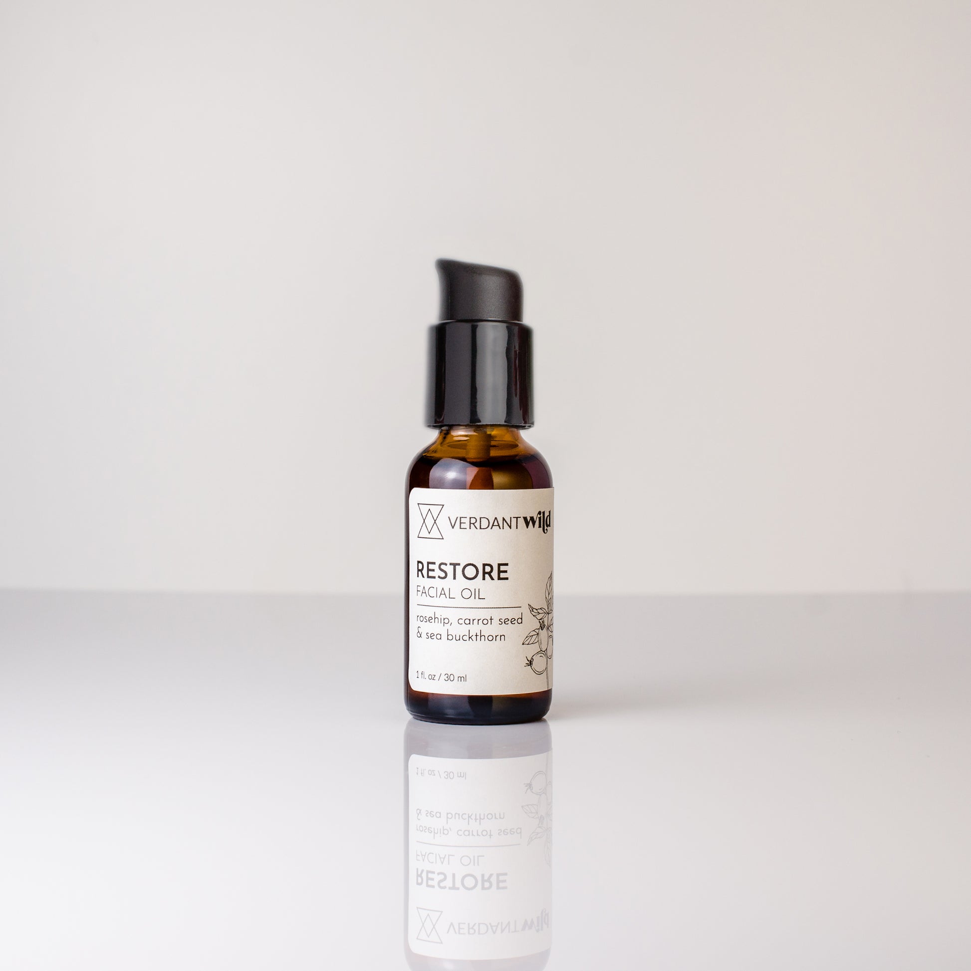 Bottle of Verdant Well Restore Oil on a white background