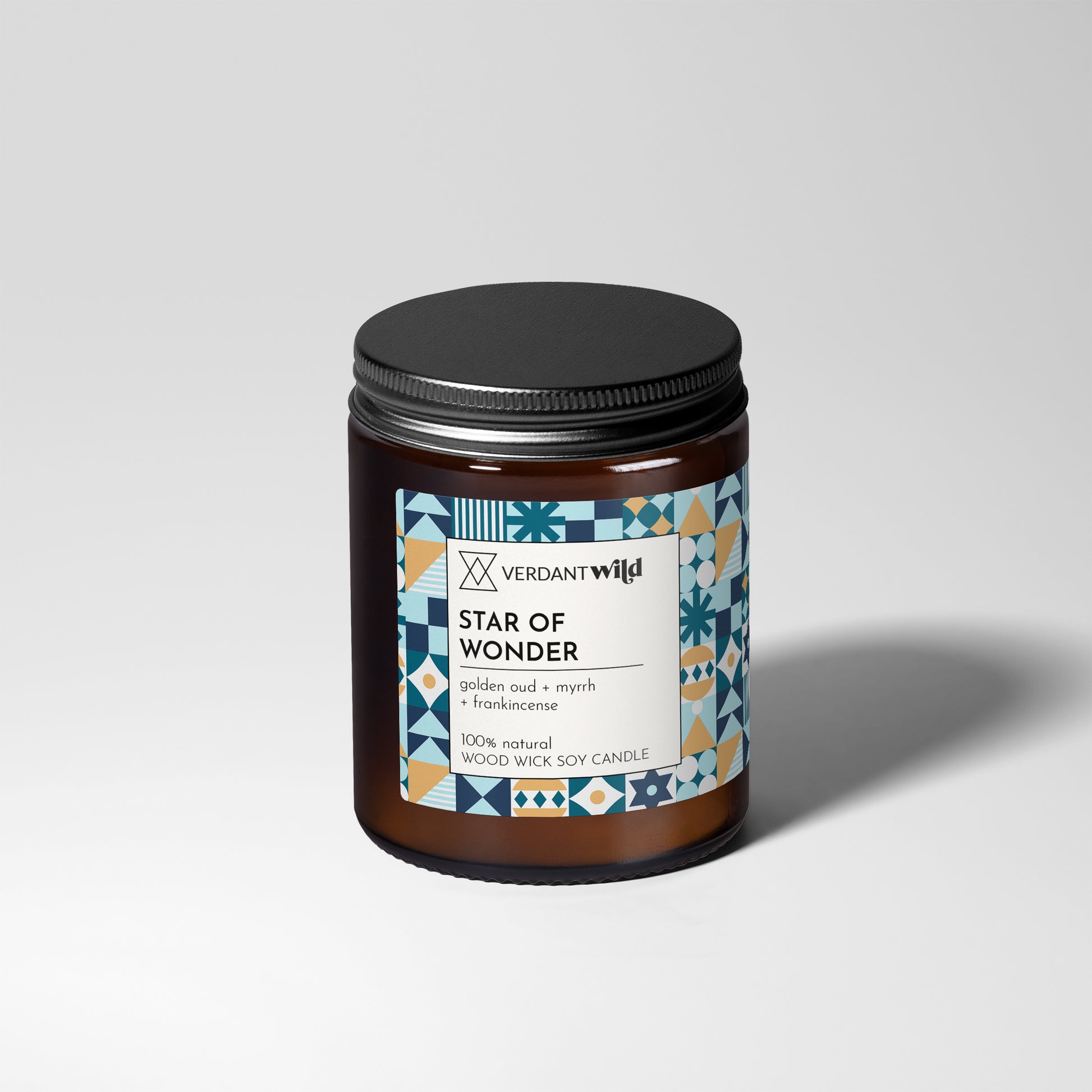 Candle jar labeled 'Star of Wonder' by Verdant Wild on a light gray background