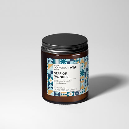 Candle jar labeled 'Star of Wonder' by Verdant Wild on a light gray background