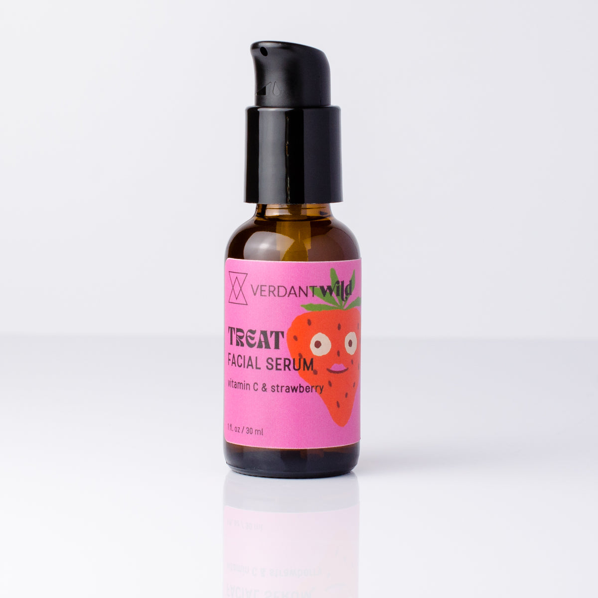A small amber glass bottle of Verdant Wild vitamin C Facial Serum with a black pump and a bright pink label featuring a cartoon strawberry, centered on a clean white background.
