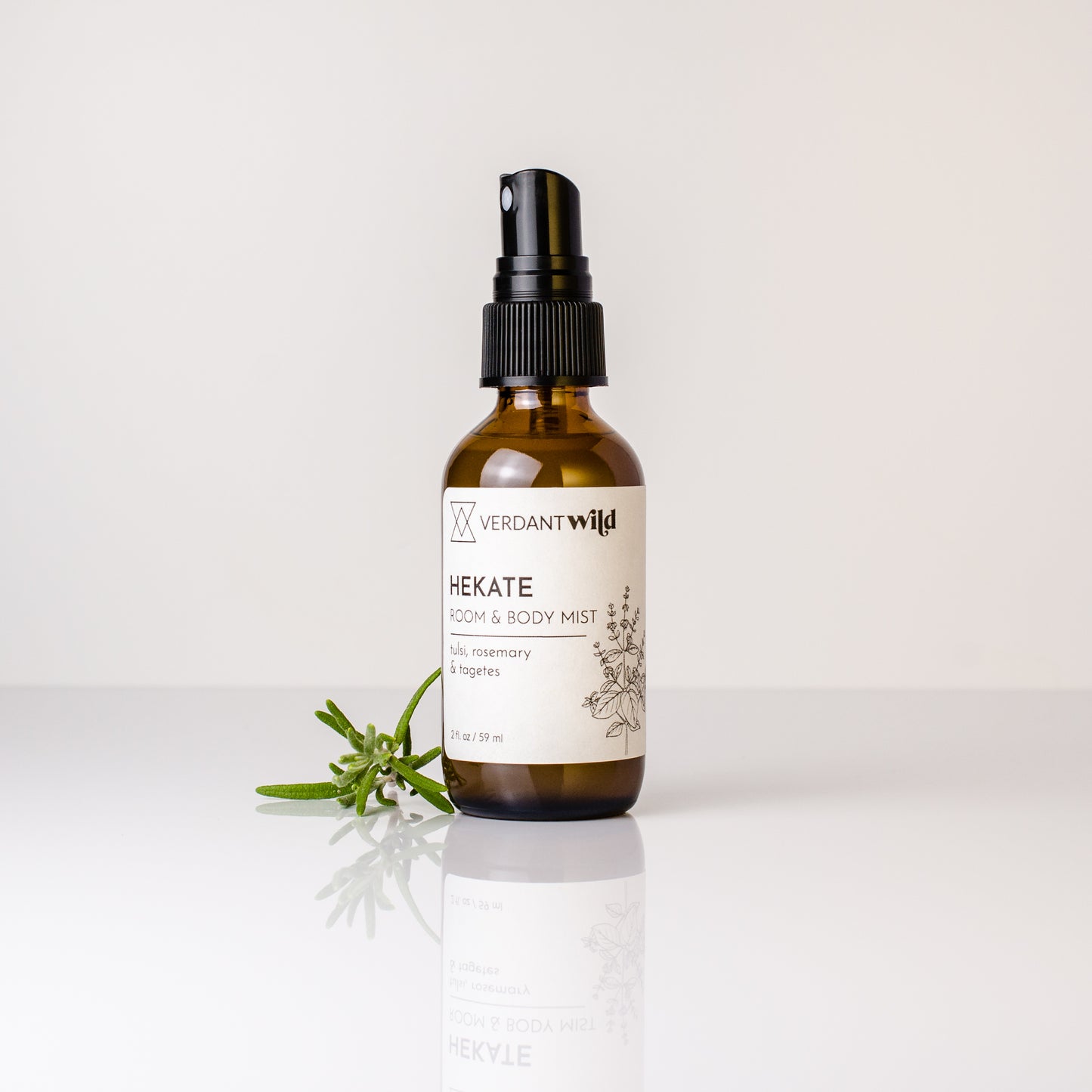 tulsi, marigold and rosemary room and body ritual mist open with sprig of rosemary