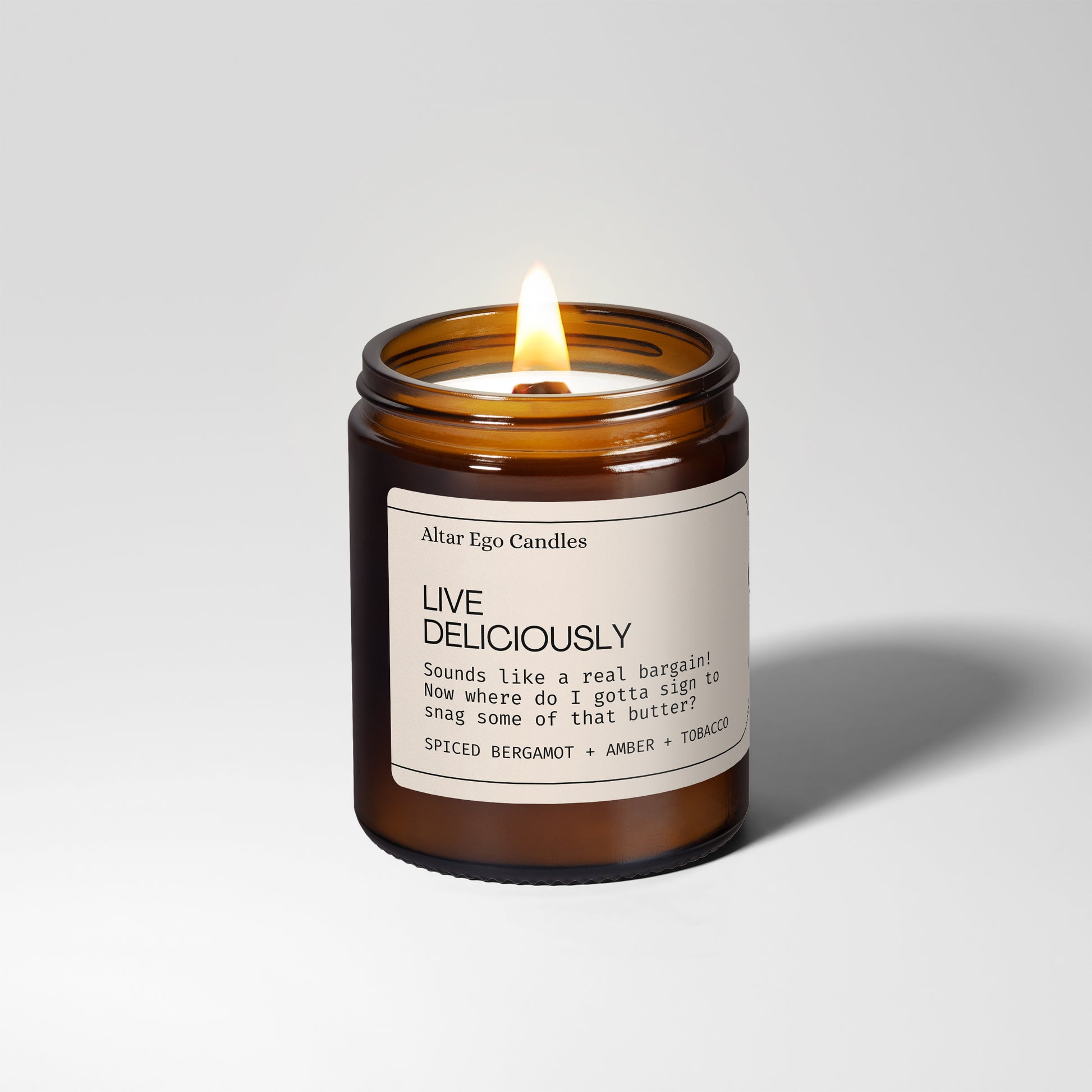 spiced bergamot, amber and tobacco soy wood wick natural candle lit
