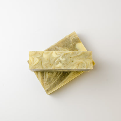 Two bars of soap with a decorative pattern on a white background